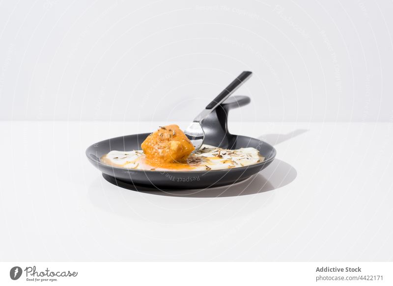 Fork with piece of bread dipped in yolk of fried egg fork skillet food breakfast dish meal delicious portion tasty cuisine fresh minimal simple plain appetizing