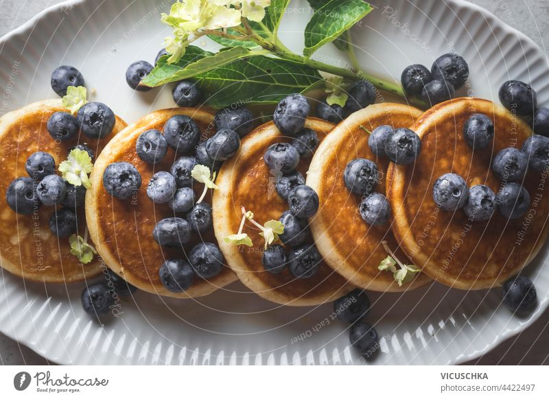 Close up of tasty breakfast with blueberries pancakes . Top view close up top view blueberry homemade culinary delicious plate syrup food sweet