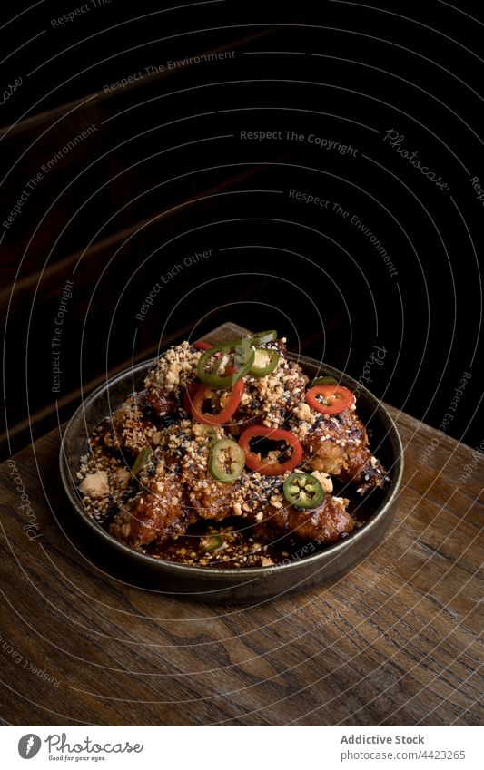 Chicken wings decorated with peppers chicken appetizing meal grill delicious cuisine fast food roast tasty sauce bbq restaurant dish meat fried portion spicy