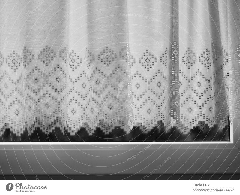 An old fashioned curtain behind closed window Moody Textiles Closed shape Drape at the window Window drapes Light Curtain Shadow Bright White Flat (apartment)