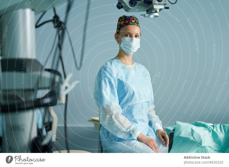 Surgeon in medical uniform working in operating room woman surgeon mask profession portrait specialist sterile nurse clinic doctor surgical hospital