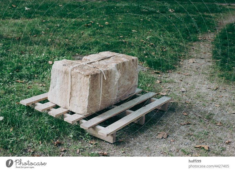 block of stone tied up on a pallet stone blocks Sculpture Delivery Packaging Transport Package Shipping Cuboid Ashlar Sandstone Granite Limestone Parcel Cargo