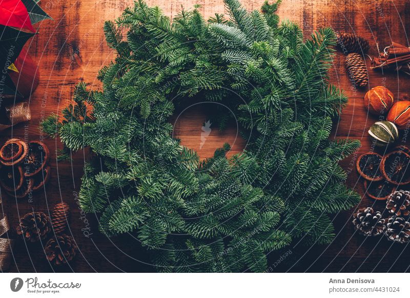 Method of making a Christmas wreath Wreath Production merry christmas handcrafted Jawbone Pine cone Citrus fruits Fir tree New Year Green celebration DIY hobby