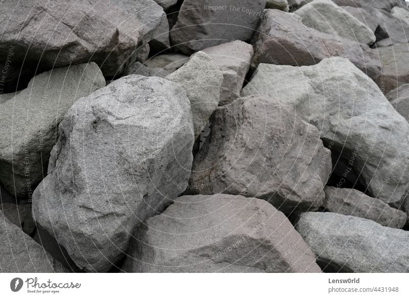 Big rocks along the coast of Iceland background big crushed dust excavation gray grey heavy material mine mineral pattern quarrying shape stone surface texture