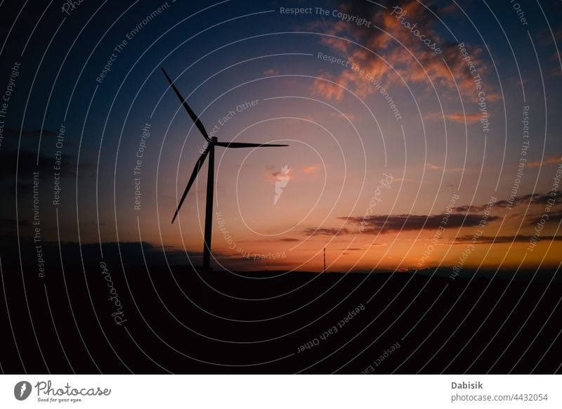 Windmill silhouette at sunset sky. Wind turbine generator energy wind windmill technology warming propeller sustainable landscape eco electric concept industry