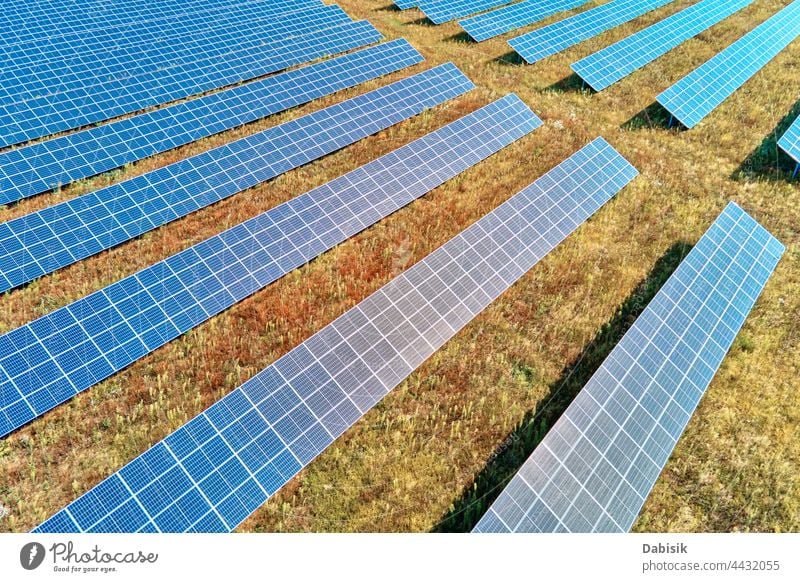 Solar panels farm in the field solar battery energy power sun alternative sustainable renewable plant photovoltaic ecosystem environmental green industry aerial