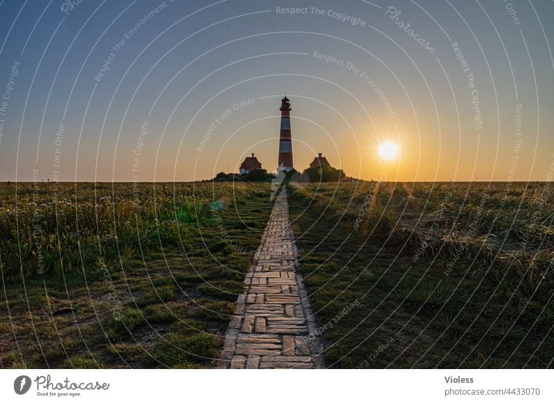As the land, so the lighthouses Westerhever Lighthouse North Sea rays dazzling Blue coast Dark Westerhever lighthouse Landscape Tourism Vacation & Travel