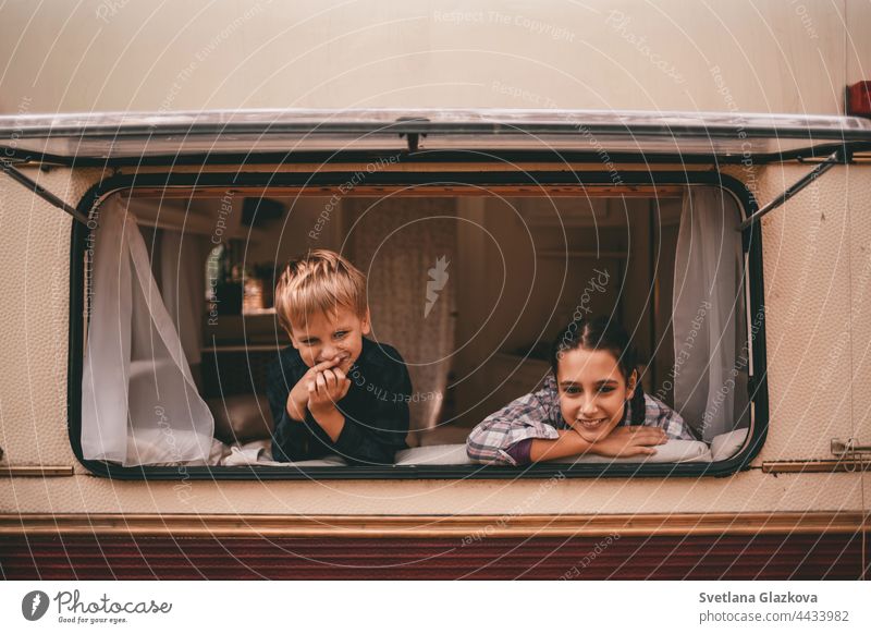 Happy family on a camping trip to relax in the autumn forest. Camper trailer. Autumn season outdoor trip Family To fall Nature Father Mother Together fun people