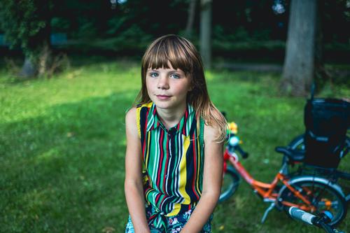 Portrait of a girl with a bicycle in a park tree nature outdoors people adventure trees spring woods lifestyle recreation caucasian beautiful beauty bike child
