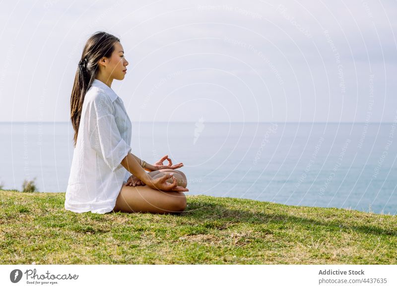 Focused man practicing meditation on lotus pose - a Royalty Free Stock  Photo from Photocase