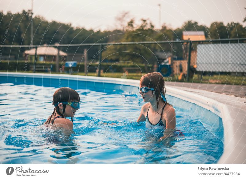 Children playing in the outdoor pool sport people health blue activity swim splash recreation resort swimming pool water holiday park active adventure beautiful