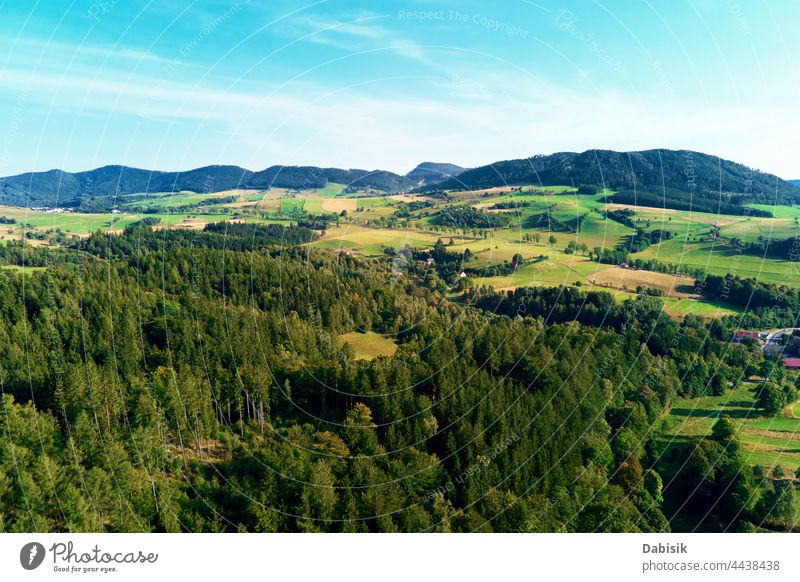 Mountains and green fields, aerial view. Panorama of beautiful landscape mountain background meadow hill valley grass pasture sky horizon spring air nature sun