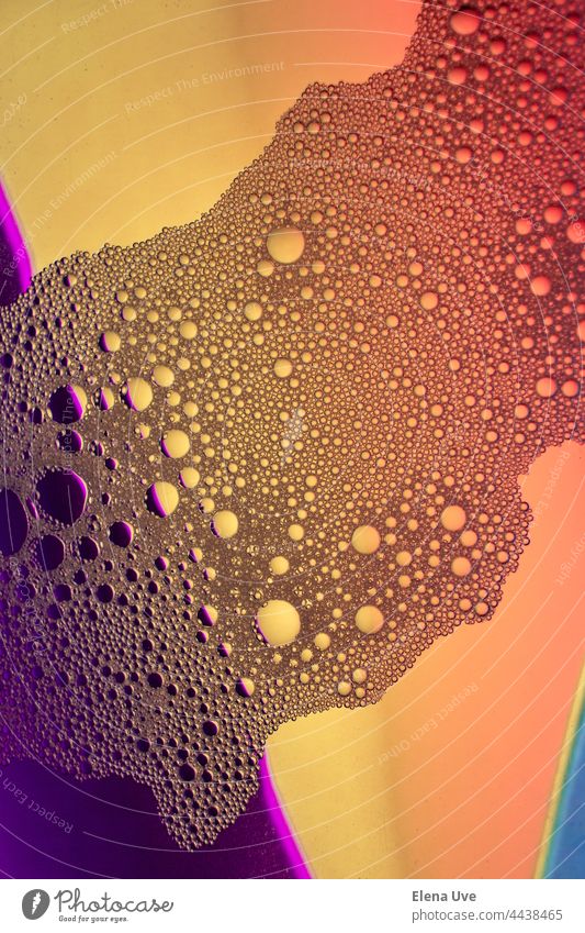 Close-up of water bubbles with orange and purple tones. Water complete no people Drops of water Pattern Wet Crystal Studio shot Art background underwater