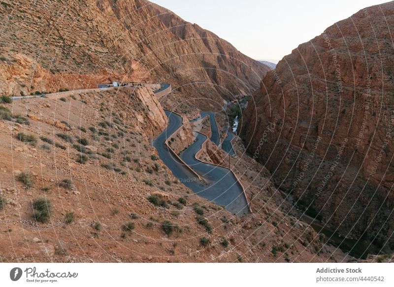 Canyon with curved roads between ridges in daytime gorge dades river nature highland landscape geology massive atlas kingdom scenic morocco magnificent rugged