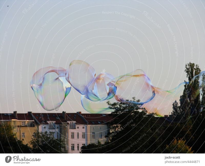 Soap bubbles in Mauerpark Light heartedness Weightlessness short-lived Transformation Hover Ease Neutral Background Cloudless sky Street art Glittering