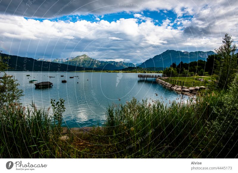 2021 07 18 Lago Di Santa Croce boats at the lake 8 nature dolomites outdoor landscape water italy tourism europe alpine alps wooden autumn mountains ship
