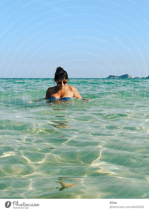 Woman bathing in the sea Ocean bathe Beach vacation Bikini Sunglasses Summer Vacation & Travel Swimming & Bathing Water Summer vacation Relaxation tanned