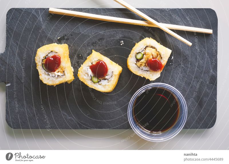 Fushion food of cooked and hot chicken sushi fushion japan japanese occidental modern tasty fried fried shushi barbeque sauce chopsticks plate delicious