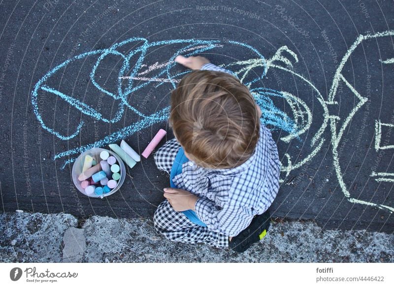 Child drawing with chalk on street Chalk Chalk drawing Painting (action, artwork) Children's game Street painting Art Creativity Infancy Playing Draw