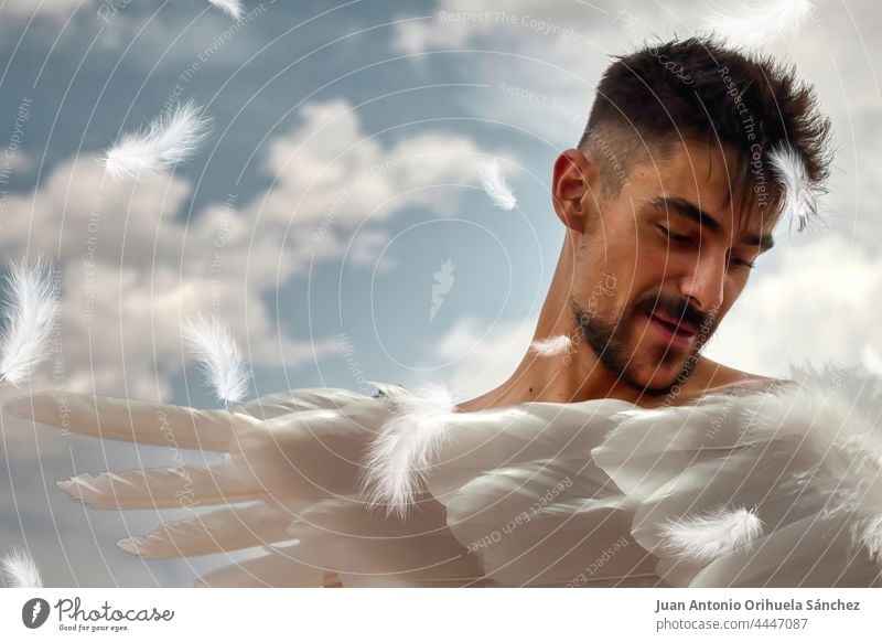 Angel. Young man with white wings and a blue sky with white clouds in the background. angel boy art fantasy magical young divine archangel angelic spirit