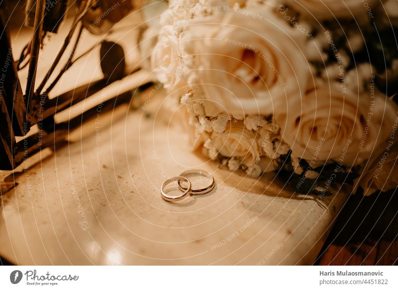 wedding rings and bouquet low light atmosphere background beautiful beauty bridal brown celebration ceremony closeup couple decoration design engagement event