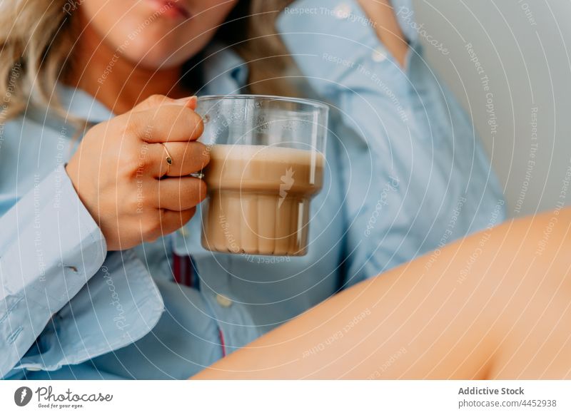 Dreamy woman enjoying delicious latte at home drink coffee hot drink beverage natural aroma foam aromatic cup scent dairy froth milk transparent dreamy