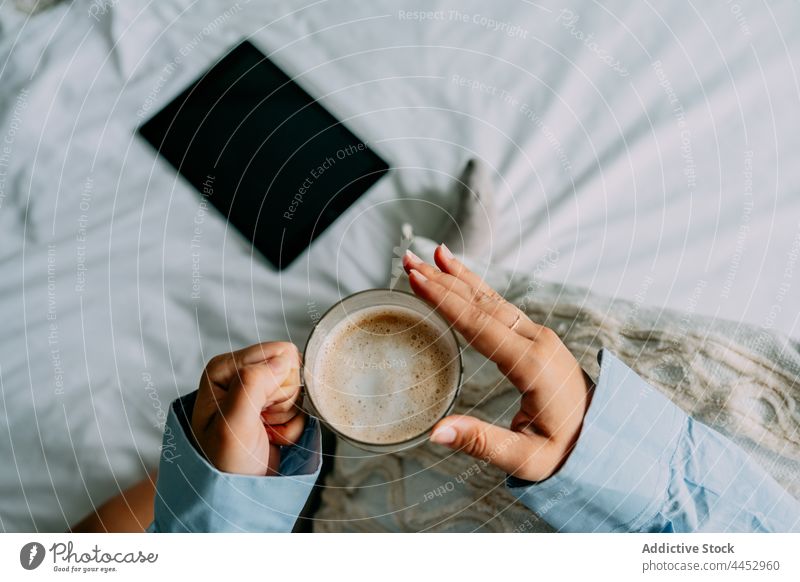 Crop woman with latte resting in house room coffee hot drink beverage lonely home shirt cushion decorative natural aroma foam aromatic cup scent dairy froth