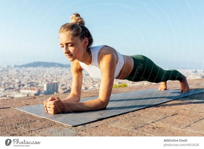 A Woman Doing a Yoga Exercise on a Yoga Mat · Free Stock Photo
