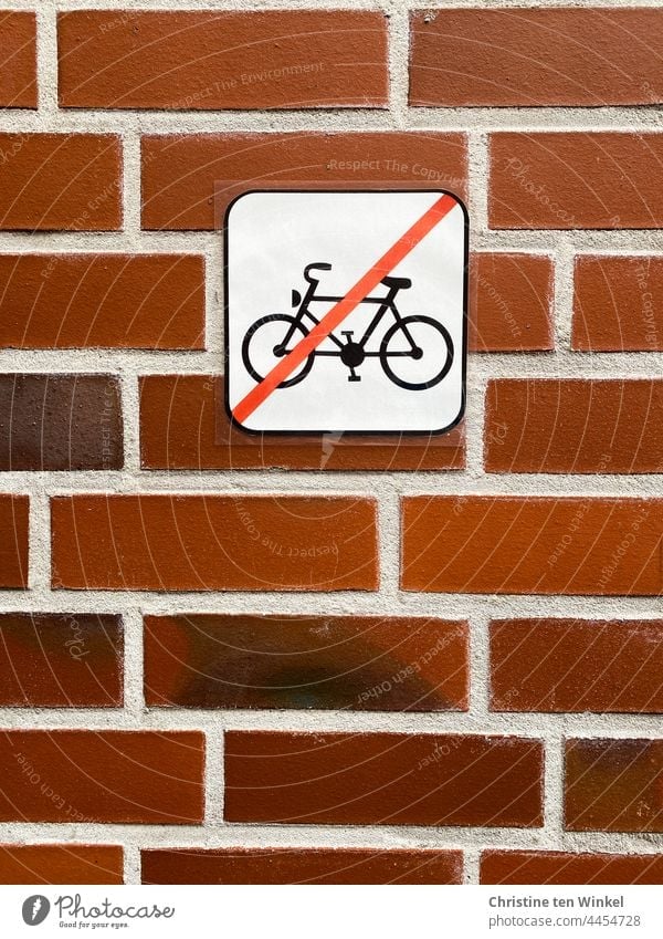 Do not park bicycles here... Pictogram on a red clinker facade Bicycle no bicycles crossed out brick wall Wall (building) Parking Clue Prohibition sign