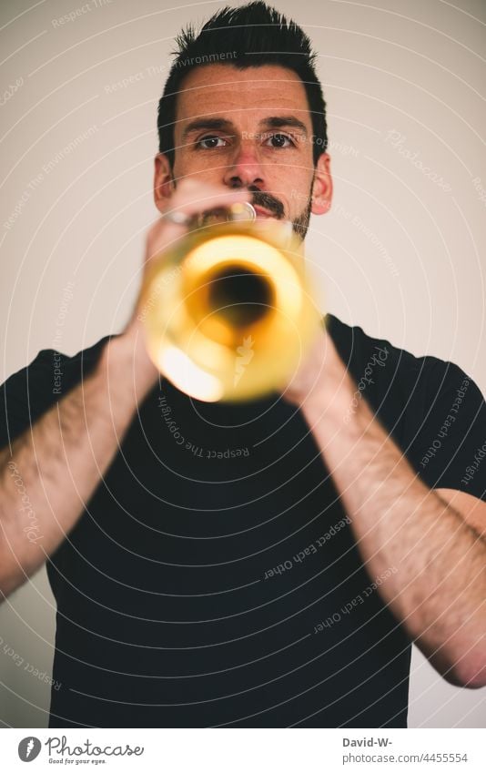 Musician plays trumpet Musical instrument Trumpet Playing Make music Culture Jazz fun Joy Sound Man