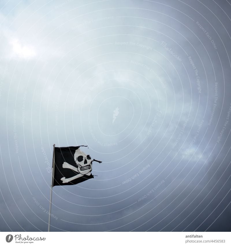 The wild times are over flag Flag pirate flag Pirate skull Sky Flagpole Wind Blow Judder Exterior shot Deserted Clouds Black White somber Bad weather Katwijk