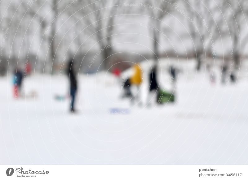 blurred people at the sledding hill. Winter blurriness sledging hill Infancy Snow winter landscape