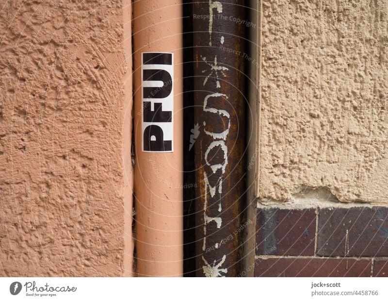 Fie / plaster next to rain pipe or downpipe Street art Pipe Wall (building) Word German Downpipe Creativity stickers Capital letter pooh Typography Plaster