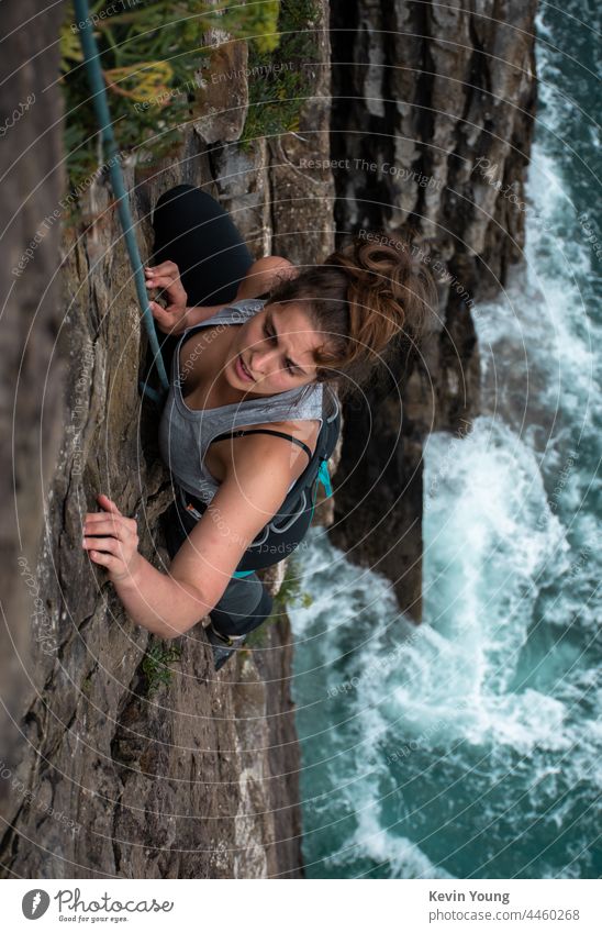 girl climbing on a cliff Girl Climbing Climber Adventure Cliff Water Brave Effort challenge courage risk fearless Exterior shot achievement