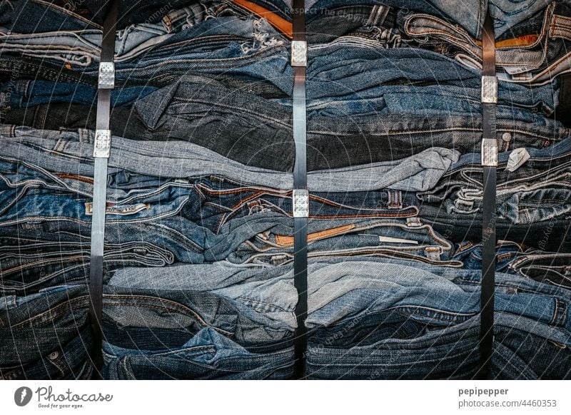 old jeans packed into a fabric bale Jeans Denim Denim blue Denim bag Blue Clothing Fashion Pants Cotton plant Detail Close-up Material Design Abstract Old