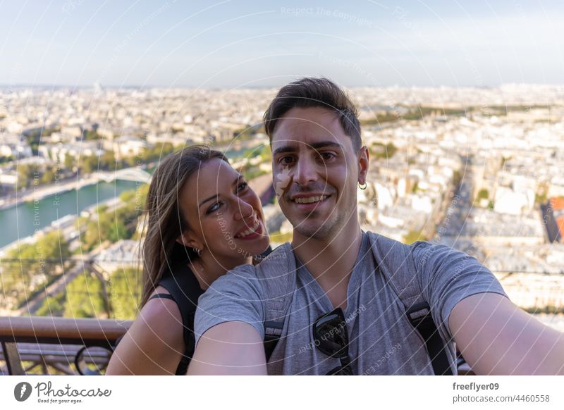 Selfie of a couple on top of the Eiffel tower selfie eiffel paris copy space france europe tourists heterosexual love young young adult boyfriend pretty home