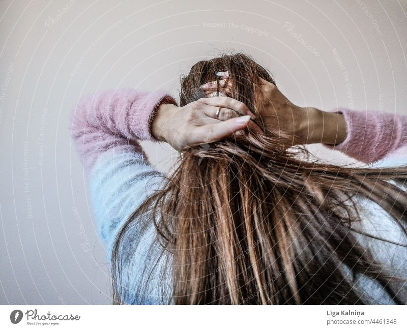 Woman putting up her hair Hair Hair and hairstyles Strand of hair Head Hands