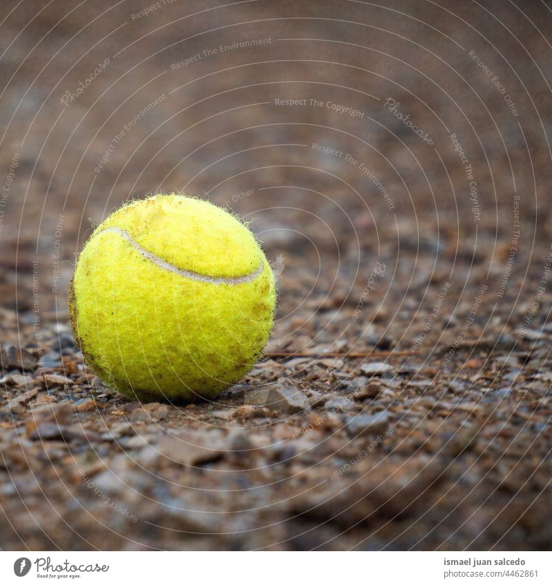 yellow tennis ball on the ground sport Sports equipment Playing Ball sports Leisure and hobbies outdoors object Still Life Yellow yellow ball dirty