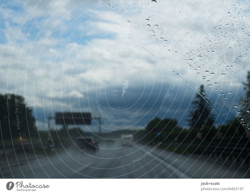 on the motorway during heavy thunderstorms Rain Bad weather Highway Storm clouds Sky Windscreen Drops of water Clouds Thunder and lightning