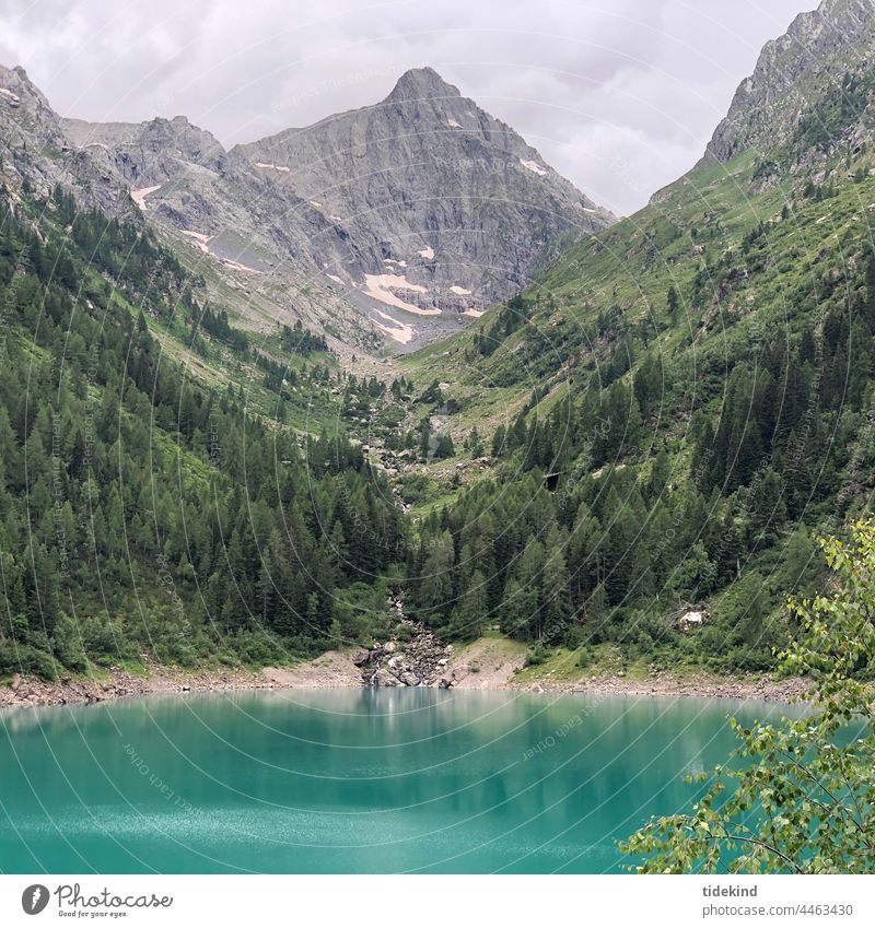 Mountain lake in the Alps mountains mountain lake Turquoise Valley Water reflection Landscape mountain panorama mountain landscape Loneliness