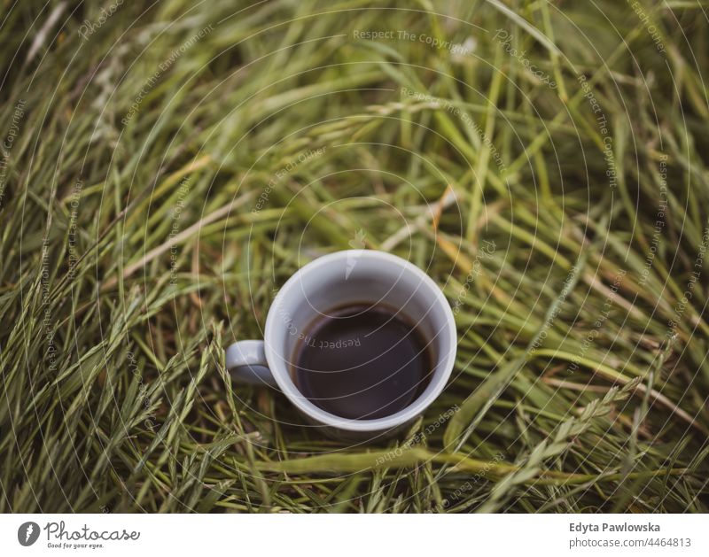 High Angle View Of Coffee Cup Over Grassy Field fresh drink field hiking travel nobody day break outside object warm garden no people park aroma espresso
