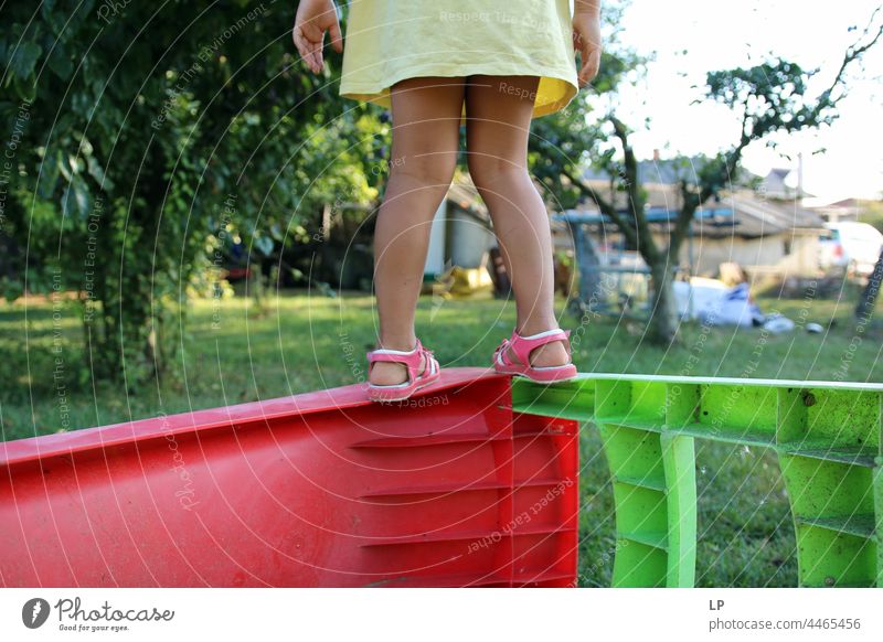 Girl standing and getting ready to jump Funny leisure Nature Legs Feet Easy Flexible Summer Multicoloured Green Vacation & Travel Playing Child Grass Meadow
