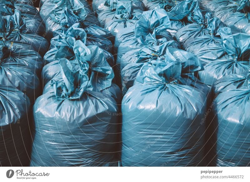 https://www.photocase.com/photos/4466572-blue-bin-liners-garbage-bags-trash-trash-container-photocase-stock-photo-large.jpeg