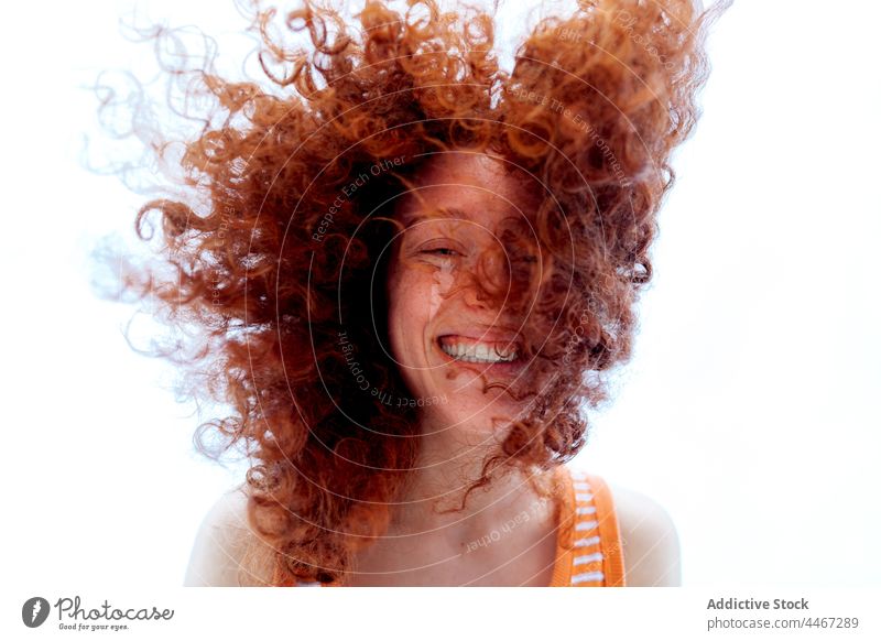 Cheerful ginger woman looking at camera laugh fun human face joy happy redhead female optimist curly hair portrait expressive having fun red hair ginger hair