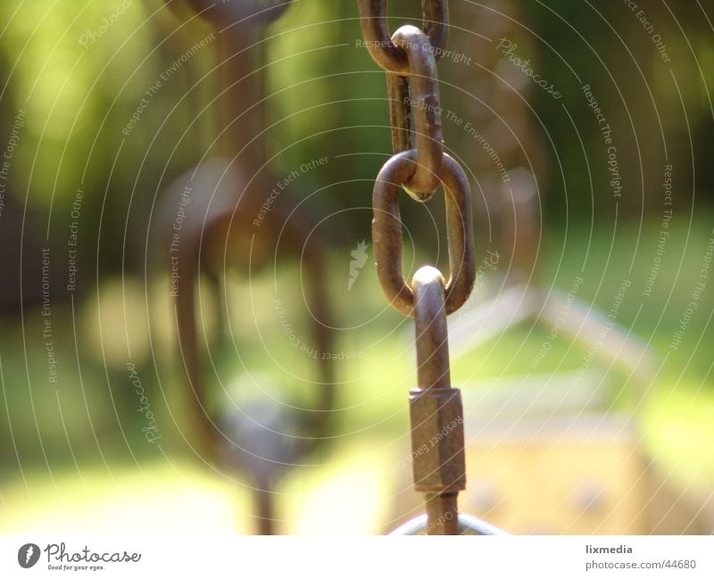 swing chain Leisure and hobbies Playground Brown Yellow Green Swing Chain link Swing chain Depth of field Detail Blur