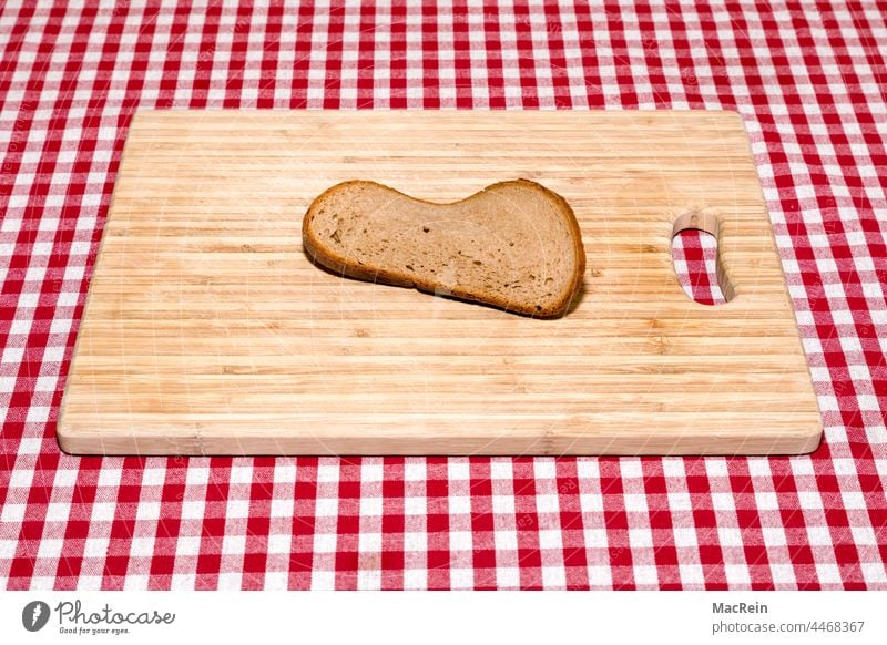 Slice of stale bread Old Bread Slice of bread breakfast board career nobody red-checked Table tablecloth Shriveled