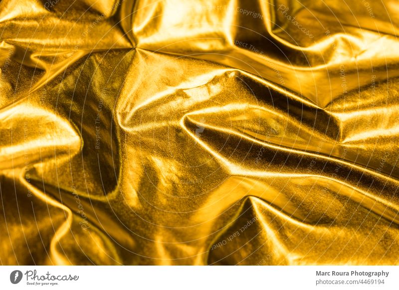 a golden silk fabric background - a Royalty Free Stock Photo from Photocase