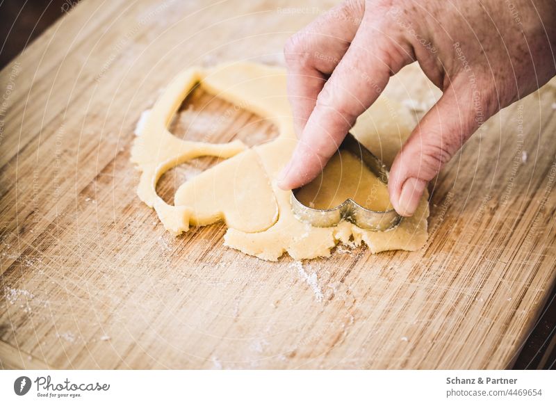 Hand cutting out cookies Christmas cut out cookies Icing pre-Christmas period Cookie Advent Baking advent season Christmas biscuit Infancy Baking tray