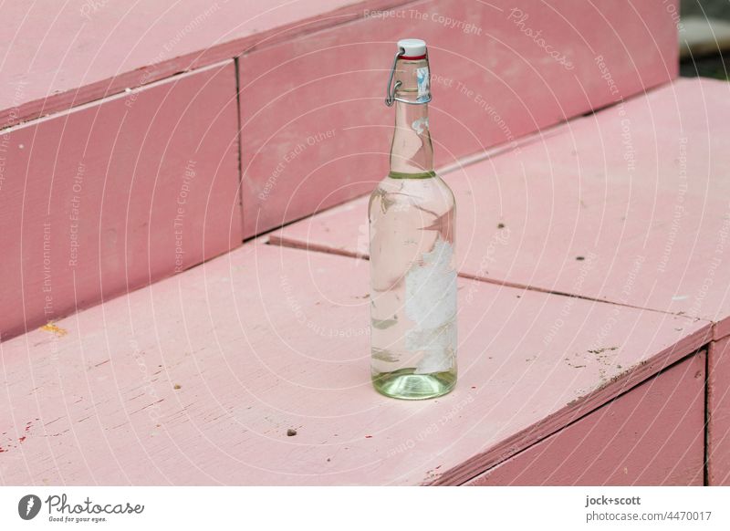 on a staircase a bottle with a swing top Bottle Neutral Background Things Glassbottle Closure Design clip-on bottle Label torn down turned off Empty Pink Stairs