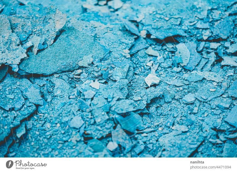 Abstract texture of cracked blue paint grunge rubble background abstract debris wreckage dry rough tones monochrome duotone cool cold freeze frozen break broken